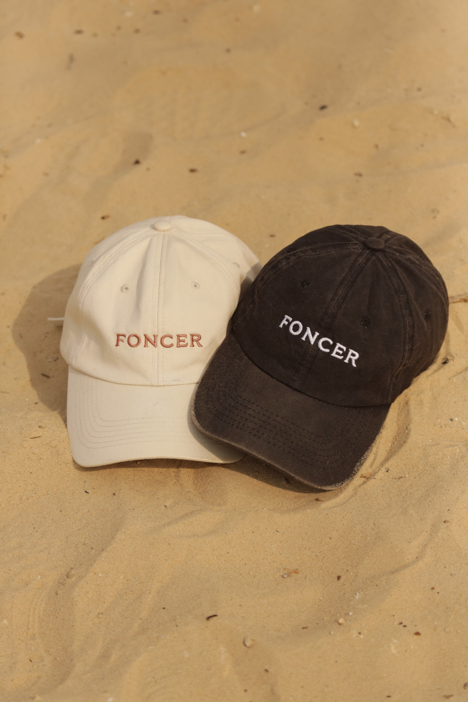 L'INITIAL cap